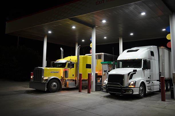 istock Two trucks from different eras refueling at gas station 2223629894