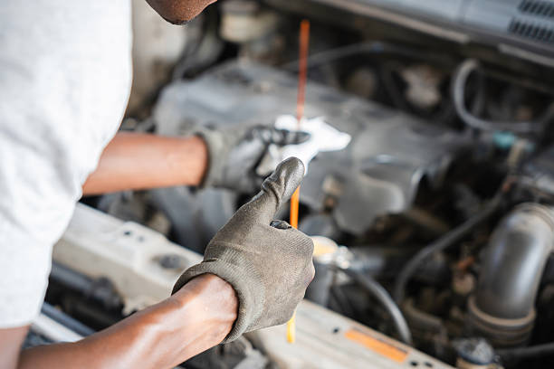 istock Mechanic Giving Thumbs Up During Car Maintenance, Auto Technician Inspecting Engine and Showing Approval, Closeup of Hand in Glove with Thumbs Up 2223630388