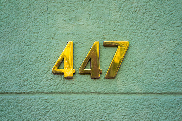 Decorative tile with the number seven on a building facade