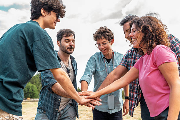 istock Diverse friends celebrating teamwork, unity, and collaboration during outdoor adventure 2223636985