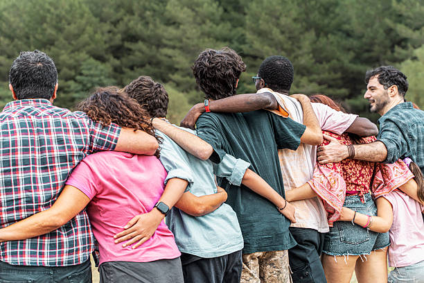 istock Diverse friends bonding in nature, exploring the outdoors with unity and community spirit 2223636986