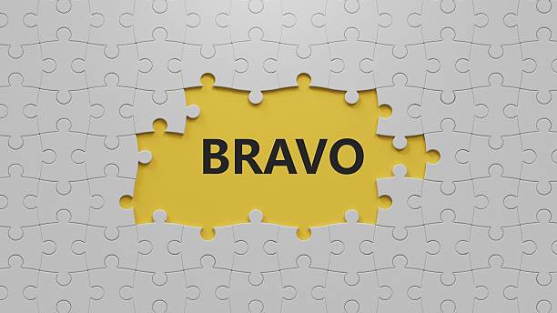 istock The word bravo appearing The white puzzle pieces with missing pieces. Education concept.close up of The white puzzle pieces with missing pieces,Business Concept.3D rendering on yellow background. 2223638996