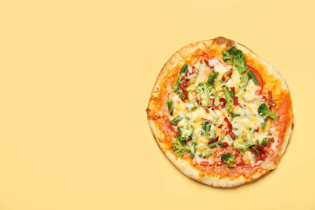 istock Delicious vegetarian pizza on yellow table, top view. Space for text 2223640902
