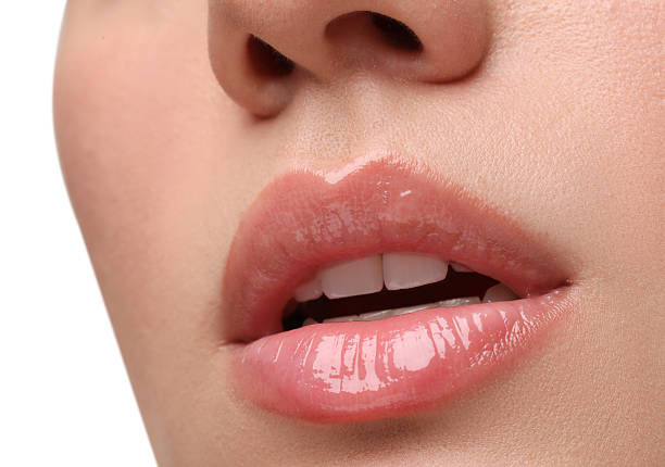 istock Woman wearing beautiful lip gloss on white background, closeup 2223641687