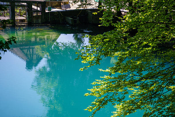 istock Water mill at the turquoise colored Blautopf spring lake, Germany 2223643238