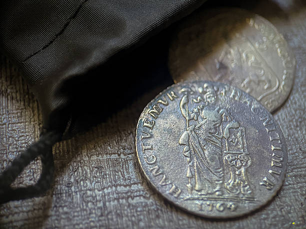 istock One guilder coin rests among other silver coins within a dark mysterious bag. 2223643289