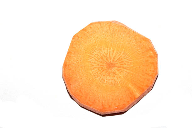 Chopped Sliced Orange Carrot Vegetable Pieces on White Background