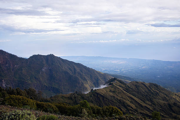 Hiking Mount Rinjani active volcano in Lombok, Indonesia with its amazing landscape