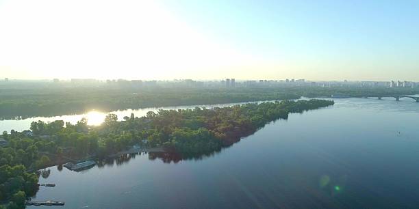 istock Wide river in sunlight. Sun outdoor view, wide scenery 2223655098