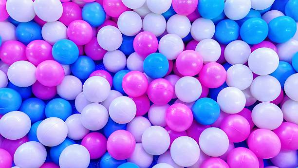 istock Colorful pastel plastic balls in a children's ball pit, top view 2223656217