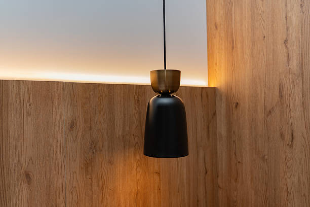 istock Modern pendant lamp with wooden wall and ambient lighting 2223660653