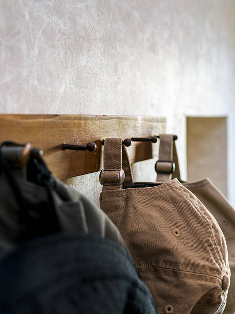Casual Caps Hanging on Wooden Hooks