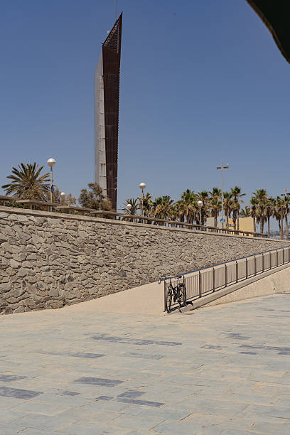 istock Sunny Promenade with Bicycle and Modern Landmark 2223660960