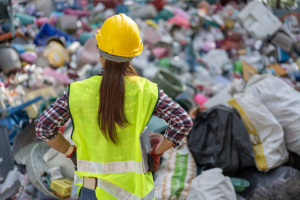 istock Female Supervisor Using Digital Tablet to Manage Waste at a Recycling Facility 2223661231