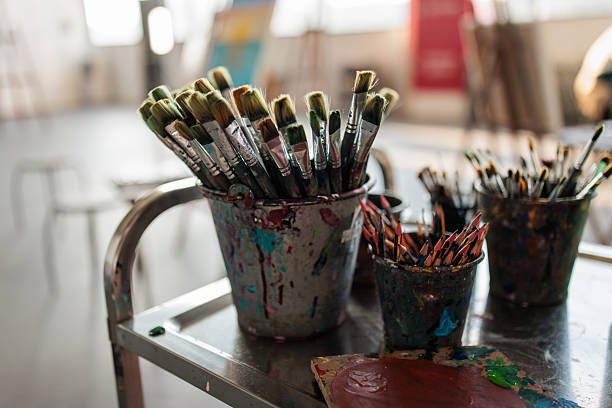 istock Art Supplies in Stained Holders Inside Artist’s Workspace 2223662558