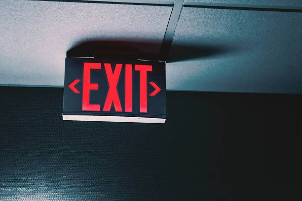 istock close-up of a red letter exit sign on a ceiling to indicate an emergency exit 2223665218