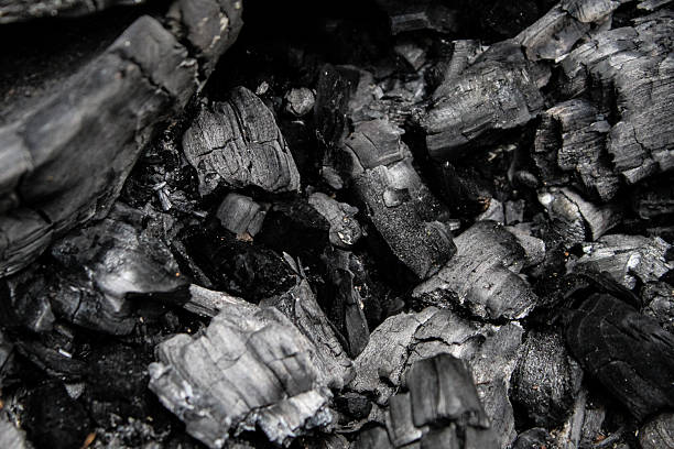 istock a pile of black charcoal pieces abstract texture background 2223665383