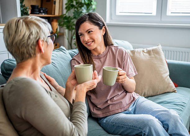 istock Mother and daughter sharing a moment of affectionate conversation over coffee 2223665470
