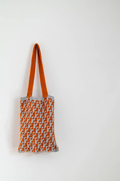istock Yellow grey crochet shopping bag on a white background. Copy space. Zero waste concept. 2223666062