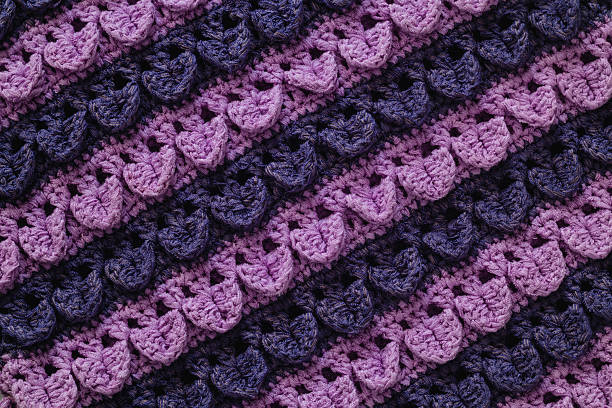 Purple blue knitted texture. Crochet crocodile stitch.