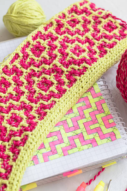 istock Geometric ethnic pattern. Rhombus - bright pink yellow crochet canvas. Womans hobby concept. 2223666494