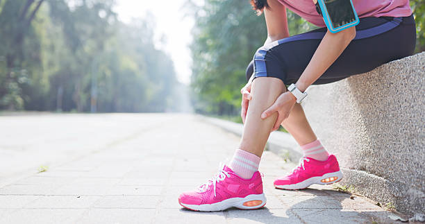 istock asian woman sporting calf cramping 2223667058