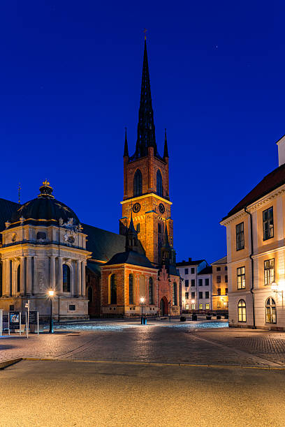 istock Riddarholmen church towering over empty square in stockholm at dusk 2223667324