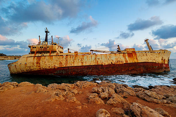 The shipwreck off Balos Lagoon in Crete is the Dimitrios P, a 35-meter cargo ship that ran aground on Imeri Gramvousa Island on January 8, 1968. It had departed from Chalkida, Greece, on December 30, 1967, carrying 440 tons of cement bound for North Africa. Adverse weather forced it to anchor near Kythira and later near Gramvousa. During the storm, the ship’s right anchor chain broke, causing it to lean and flood the engine room. The captain ordered the crew to abandon ship, and all were rescued by the Greek Navy two days later. The vessel has remained partially submerged near Gramvousa’s coast since then.