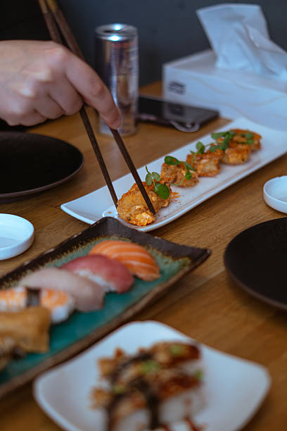 istock Hand Picking Up Fried Shrimp with Chopsticks 2223670773