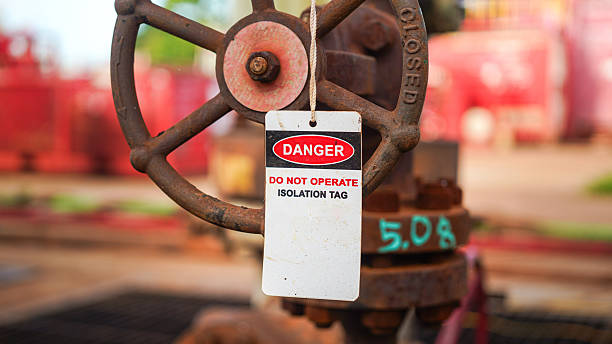 istock Isolation tag or lockout tagout which is hanged on pipeline valve. 2223671085