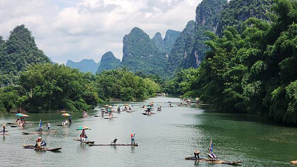 istock Bamboo rafts floating in the river 2223671193