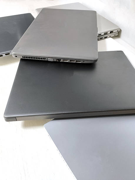 istock stack of laptops on a gray background, on the table, laptop computer, tablet, business, work, remote work, freelance. 2223673637
