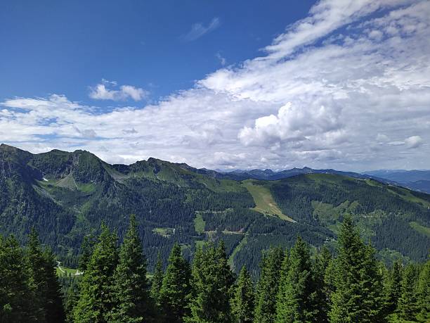 istock Panoramic View of a Lush Mountain Landscape beneath a Dramatic Sky 2223675839