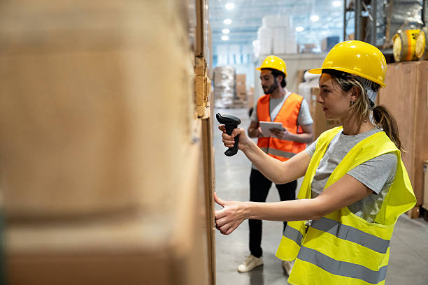 istock Warehouse Workers in Action Amidst Daily Operations 2223678964