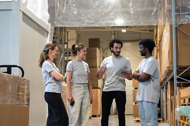 istock Multiracial Group of warehouse workers having a meeting at warehouse 2223679016