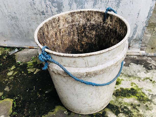 Four  old fire buckets on hooks