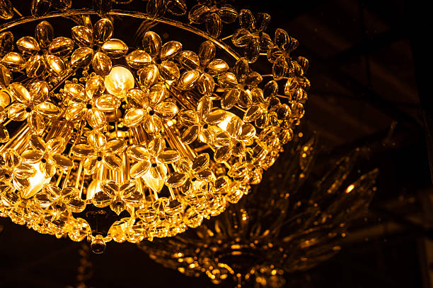 A room with a beautiful sparkling chandelier,