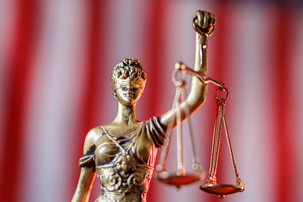 istock Lady Justice in front of American flag 2223682680