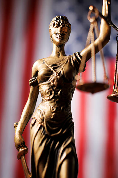 istock Lady Justice in front of American flag 2223683513