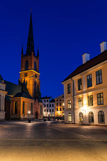 istock Riddarholmen church towering over empty square in stockholm at dusk 2223686402