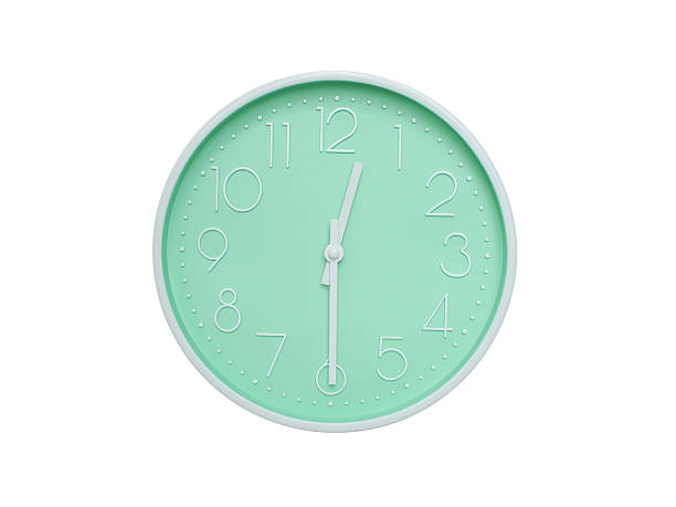 istock Modern mint green wall clock with white frame and numbers, showing 12:30 PM or 12:30. Ideal for minimalist designs, time-related content, or morning routine visuals. 2223689243