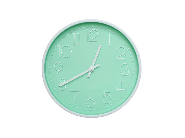 istock Modern mint green wall clock with white frame and numbers, showing 12:40 PM or 12:40. Ideal for minimalist designs, time-related content, or morning routine visuals. 2223689246