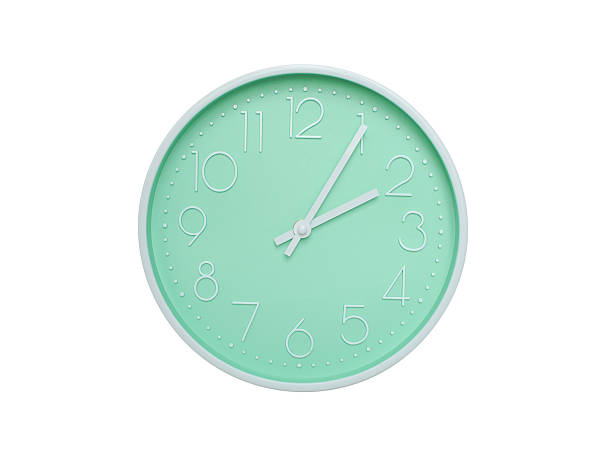 Modern mint green wall clock with white frame and numbers, showing 02:05 AM or 02:05. Ideal for minimalist designs, time-related content, or morning routine visuals.