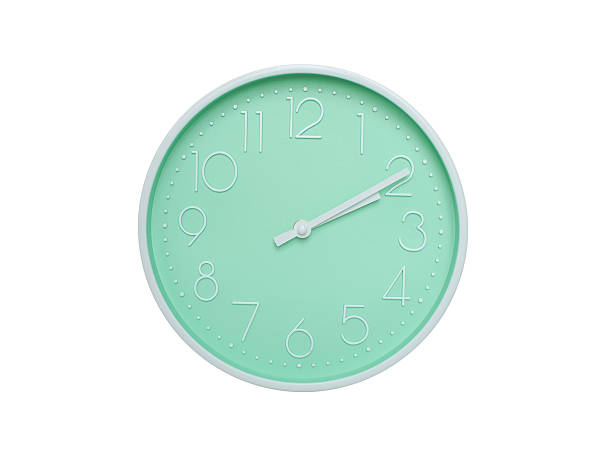 Modern mint green wall clock with white frame and numbers, showing 02:10 AM or 02:10. Ideal for minimalist designs, time-related content, or morning routine visuals.