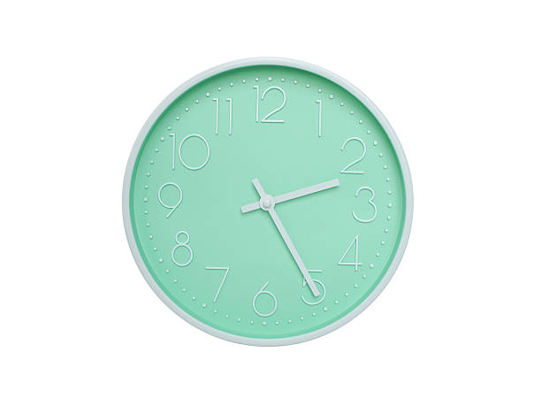 Modern mint green wall clock with white frame and numbers, showing 02:25 AM or 02:25. Ideal for minimalist designs, time-related content, or morning routine visuals.