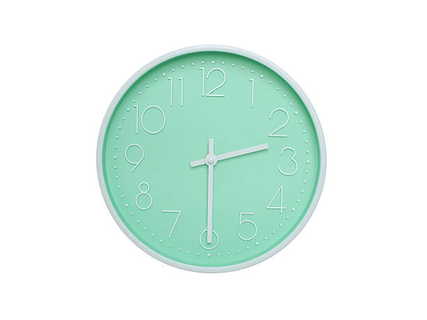 istock Modern mint green wall clock with white frame and numbers, showing 02:30 AM or 02:30. Ideal for minimalist designs, time-related content, or morning routine visuals. 2223689357