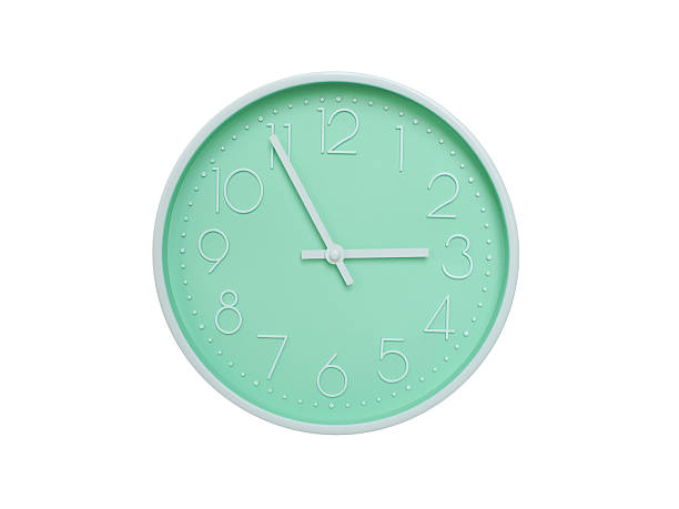 Modern mint green wall clock with white frame and numbers, showing 02:55 AM or 02:55. Ideal for minimalist designs, time-related content, or morning routine visuals.