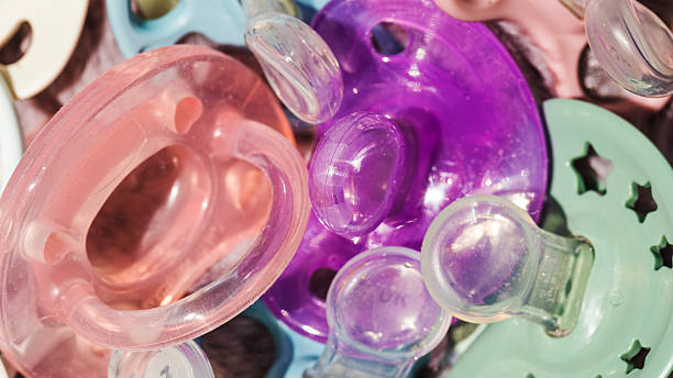 istock background with transparent colored baby dummies 2223691946