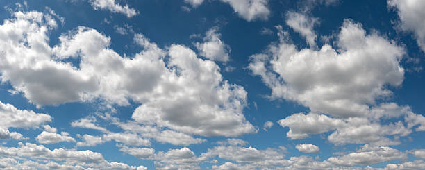 istock Panorama of a blue sky with white cotton clouds 2223694290