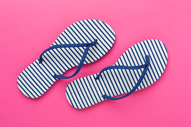 Close up of a pair of flip flop on the seaside.